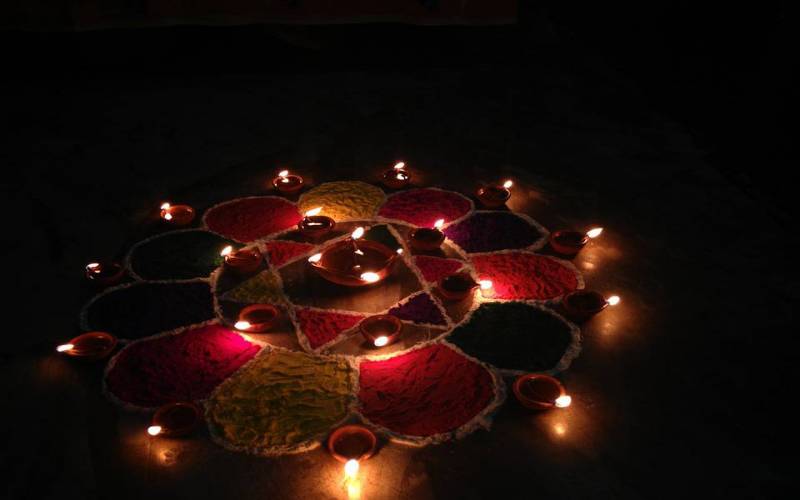 Diyas and Rangoli in Dev Diwali Festival